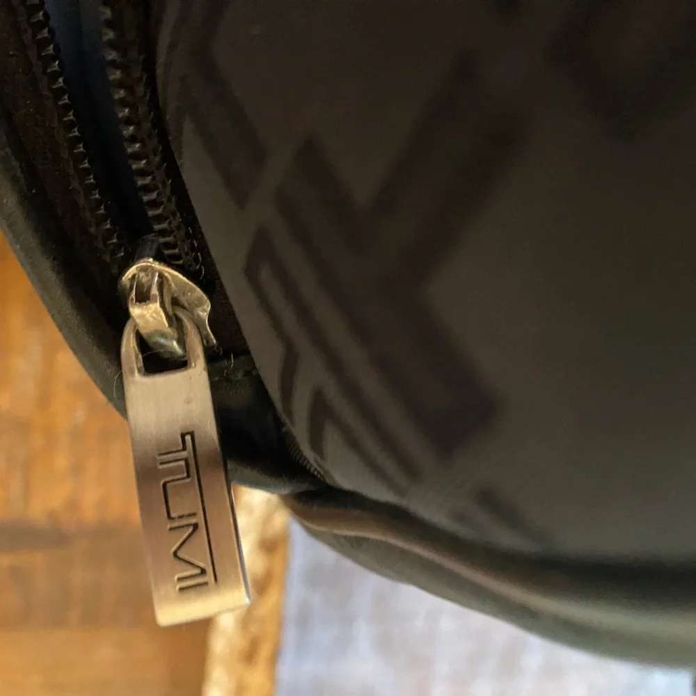 Tumi preowned definately